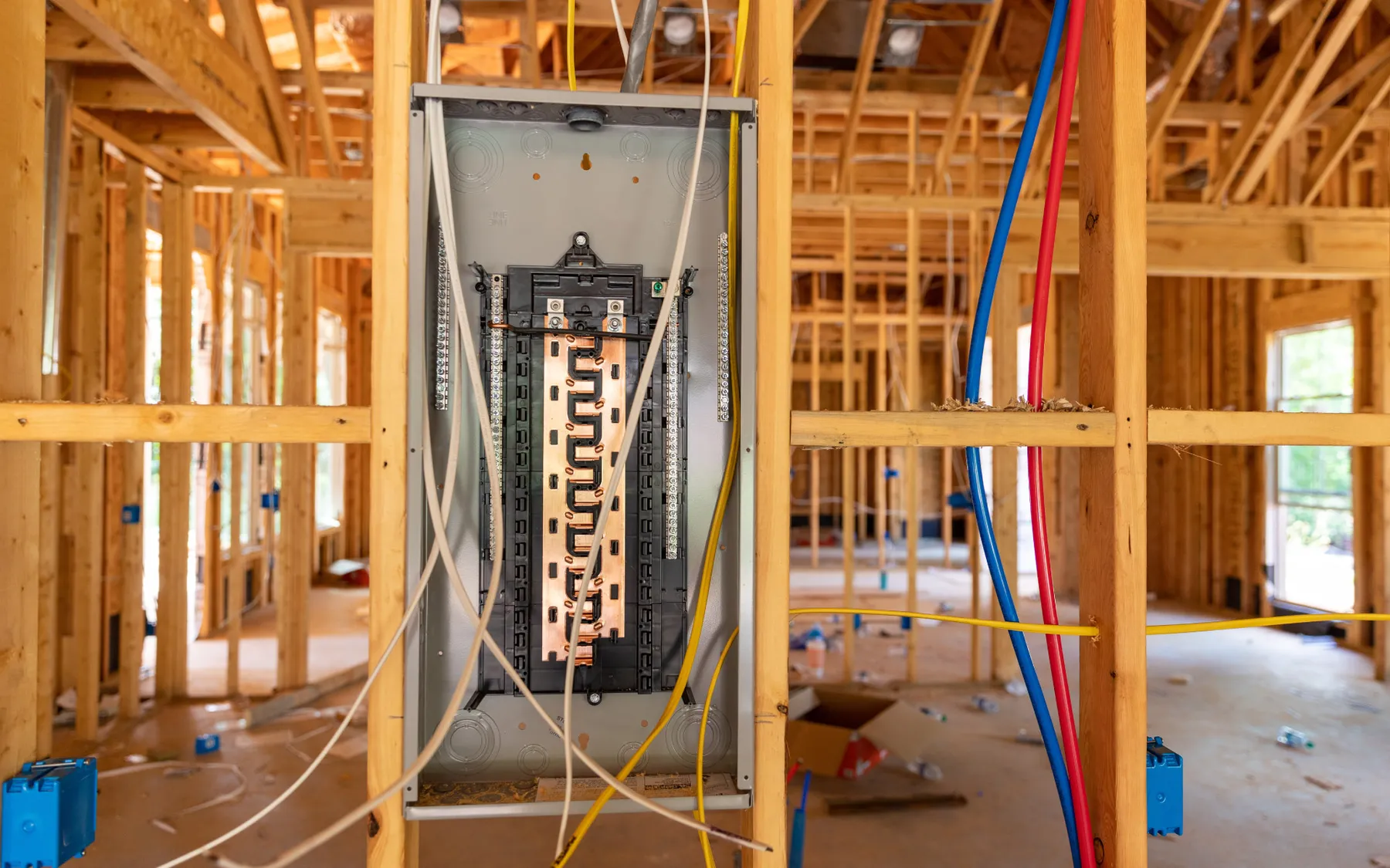 An electrical service panel in a home that is being built